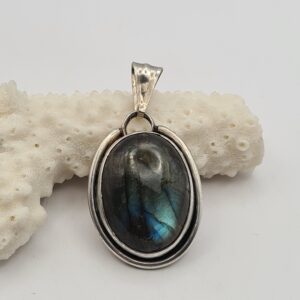 Dije plata y piedra