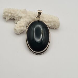 Dije plata y piedra