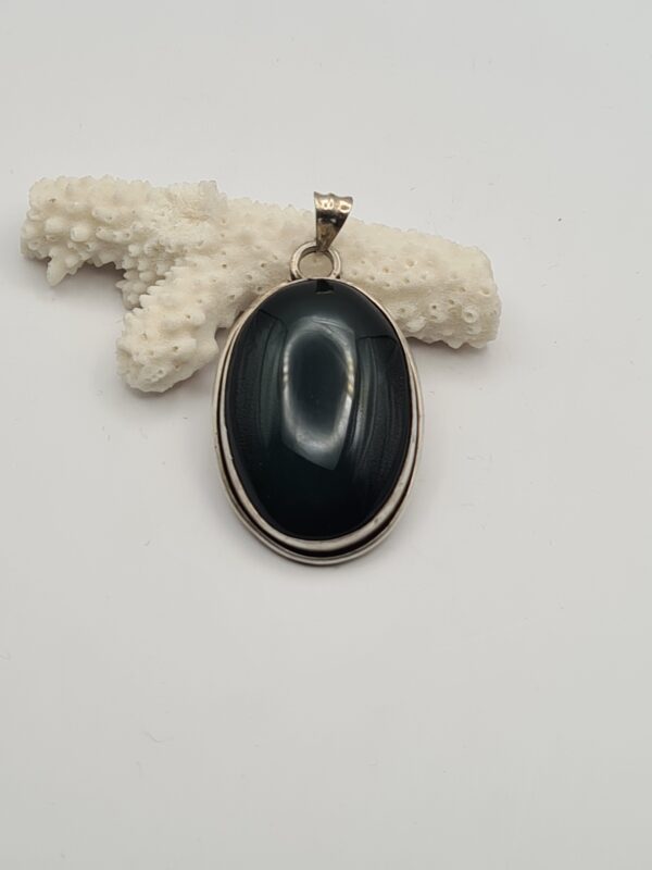 Dije plata y piedra