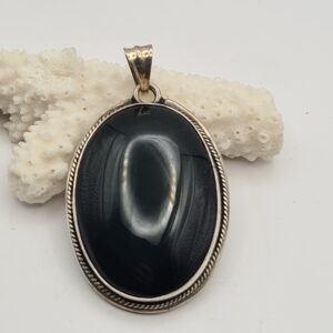 Dije plata y piedra