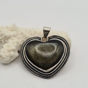 Dije plata y piedra