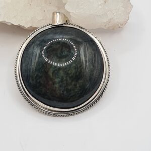 Dije plata y piedra