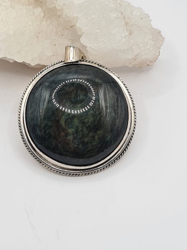 Dije plata y piedra