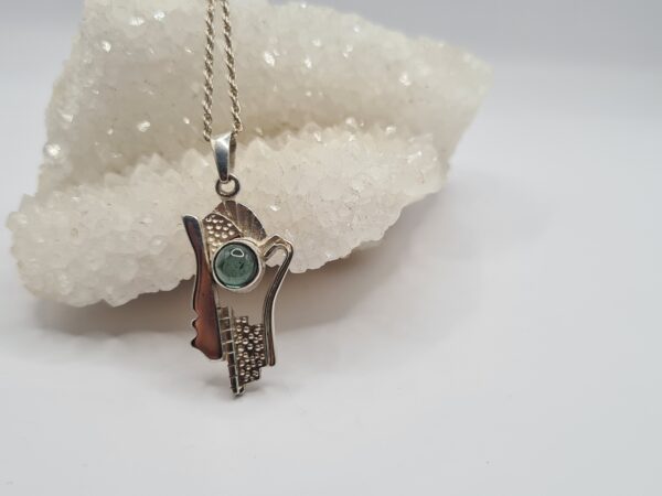 Dije plata y piedra