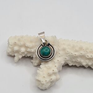 Dije plata y piedra