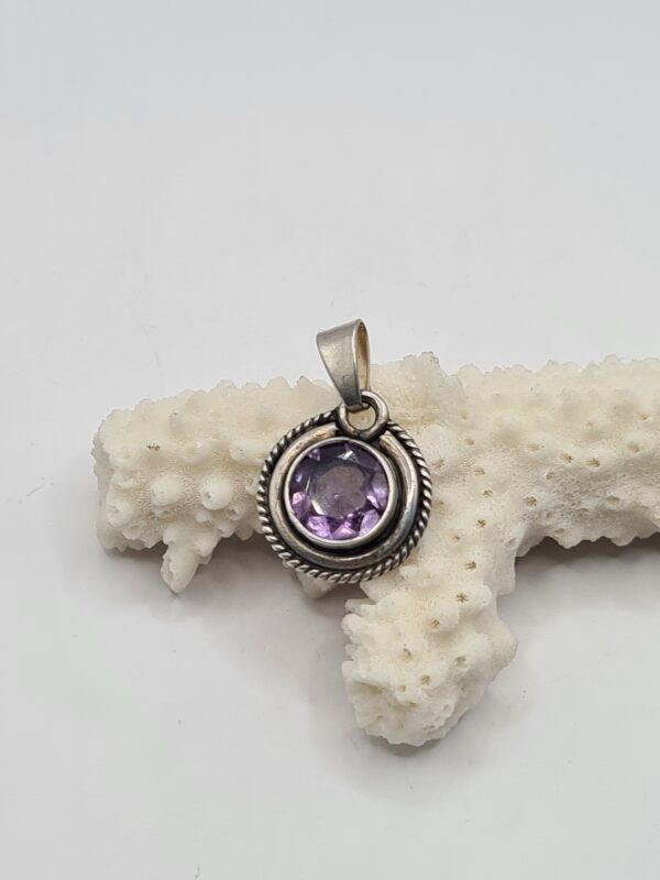 Dije plata y piedra
